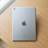 Back view of an iPad on a wooden surface